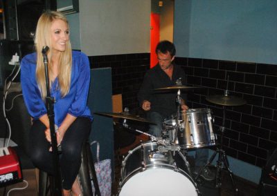 Image of Pianist Jennie and a drummer in rehearsal